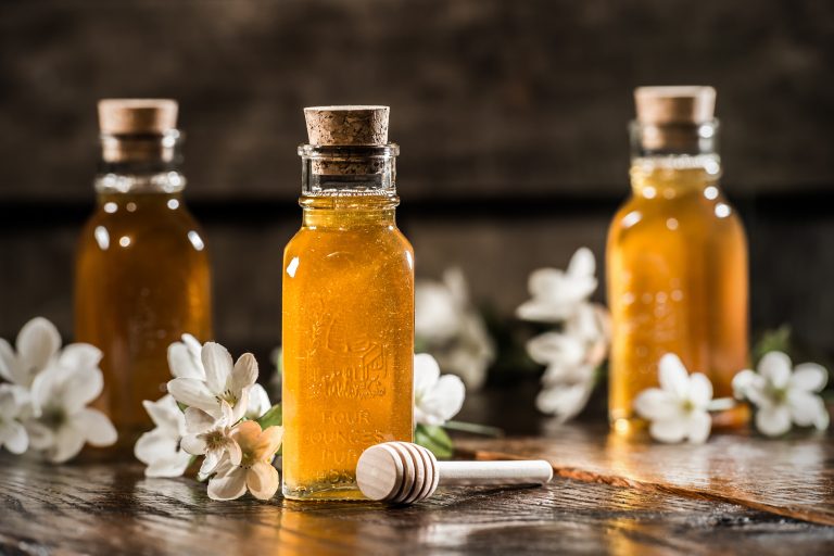 Antique Honey Jars with apple blossoms.