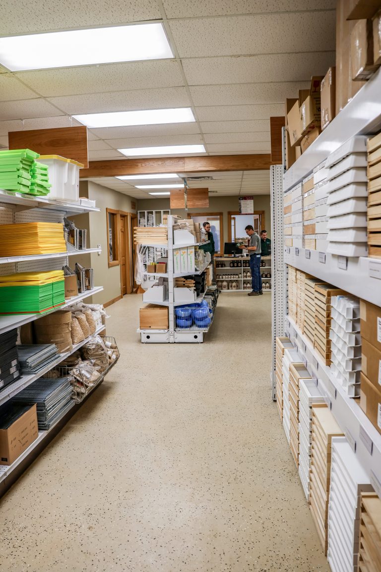 Lots of beekeeping supplies line the shelves.